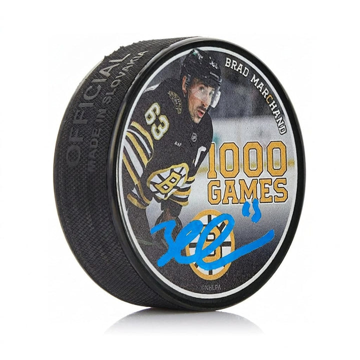 Dynasty Sports & Framing Autographed Pucks Brad Marchand Autographed Boston Bruins 1000 Games Commemorative Hockey Puck