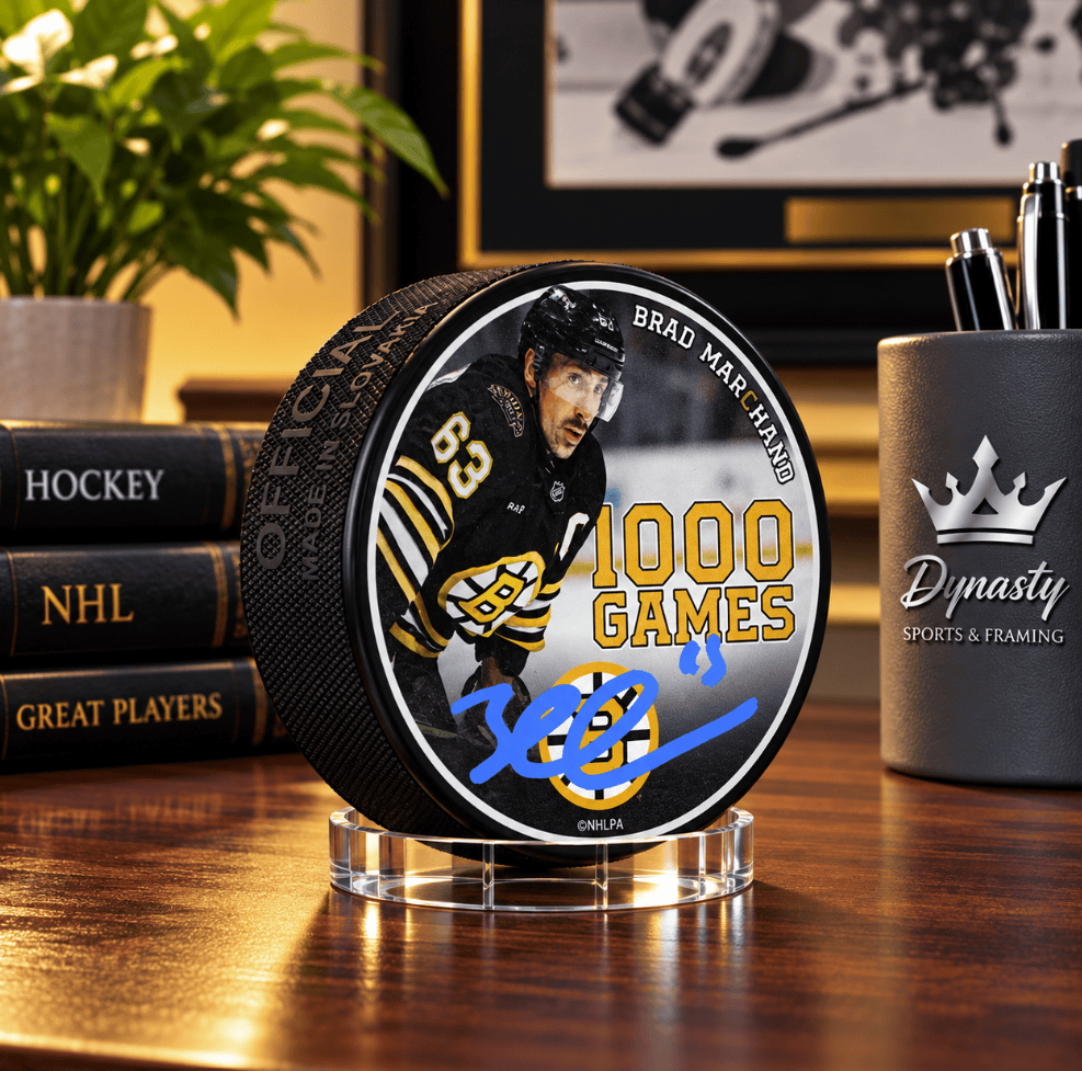 Dynasty Sports & Framing Autographed Pucks Brad Marchand Autographed Boston Bruins 1000 Games Commemorative Hockey Puck