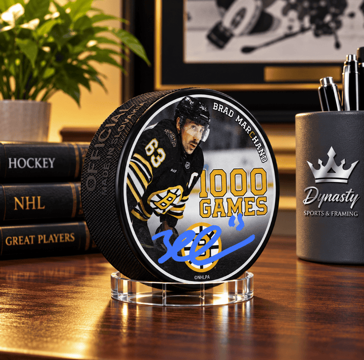 Dynasty Sports & Framing Autographed Pucks Brad Marchand Autographed Boston Bruins 1000 Games Commemorative Hockey Puck