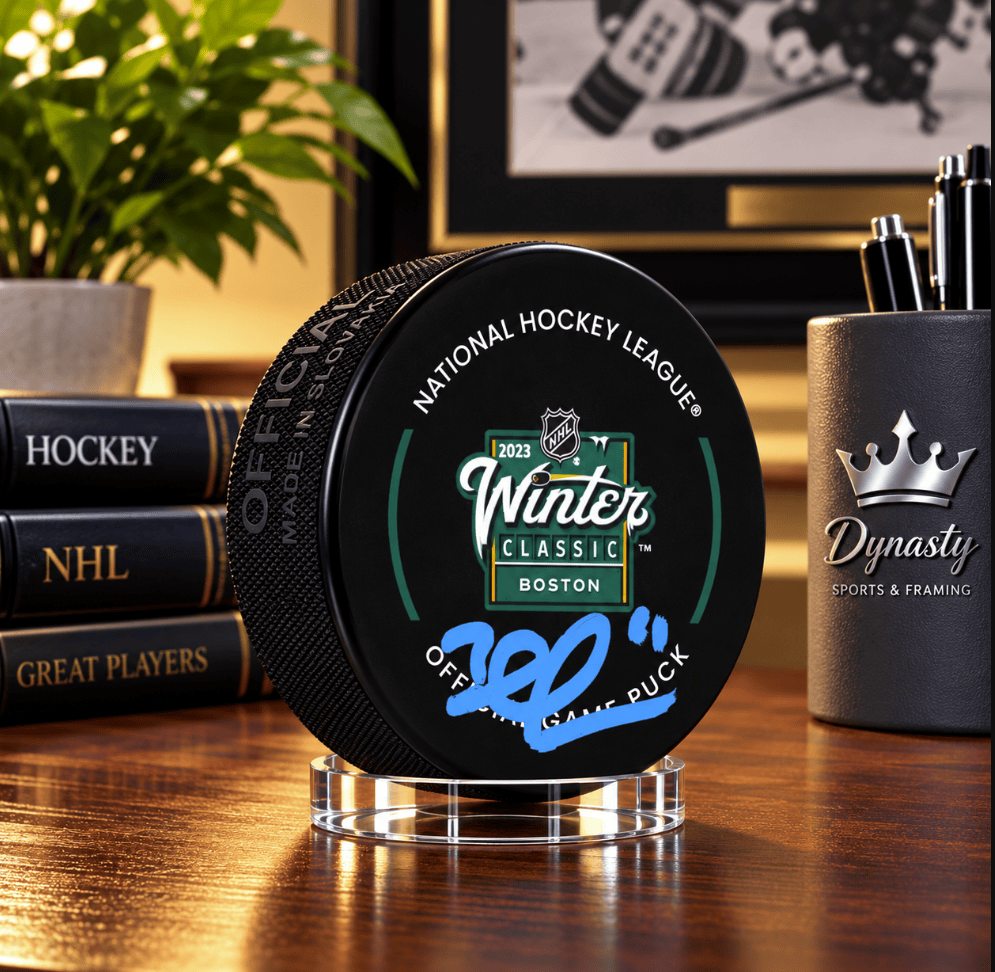 Dynasty Sports & Framing Autographed Pucks Brad Marchand Boston Bruins Autographed Official 2023 Winter Classic Game Hockey Puck