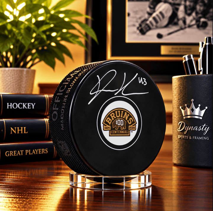 Dynasty Sports & Framing Autographed Pucks Danton Heinen Autographed Boston Bruins 100th Anniversary Hockey Logo Puck