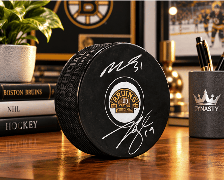 Dynasty Sports & Framing Autographed Pucks Matthew Poitras & Johnny Beecher Autographed Boston Bruins 100th Anniversary Hockey Logo Puck